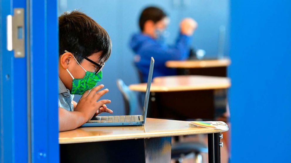 PHOTO: Students work on their laptop computers at St. Joseph Catholic School in La Puente, Calif., Nov. 16, 2020.