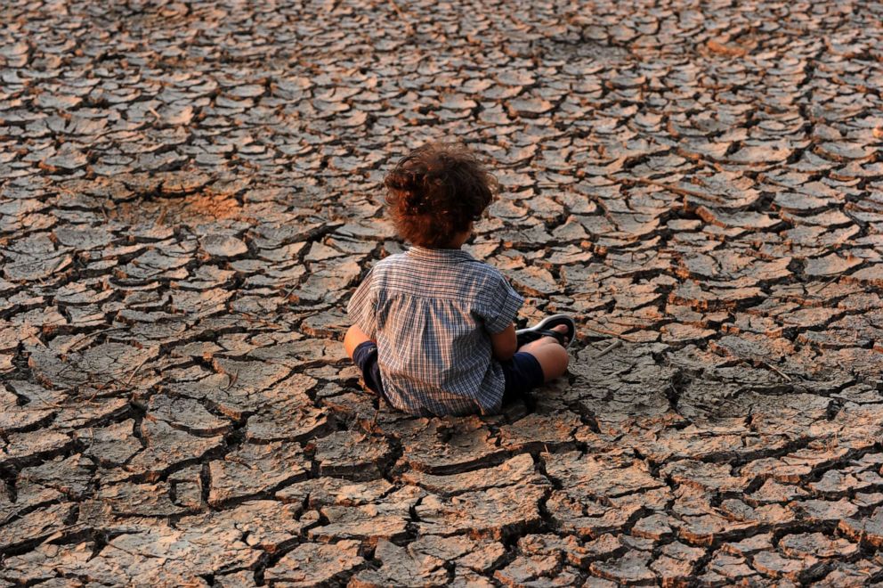 PHOTO: A child sits in at an area affected by a drought on Earth Day in the southern outskirts of Tegucigalpa, Honduras on April 22, 2016.