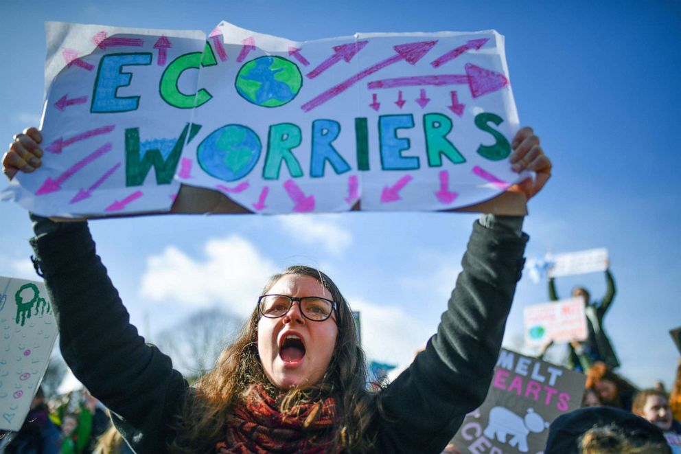 PHOTO: School children hold signs and shout slogans as they participate in a climate change awareness protest outside the Scottish Parliament on March 15, 2019, in Edinburgh, Scotland.