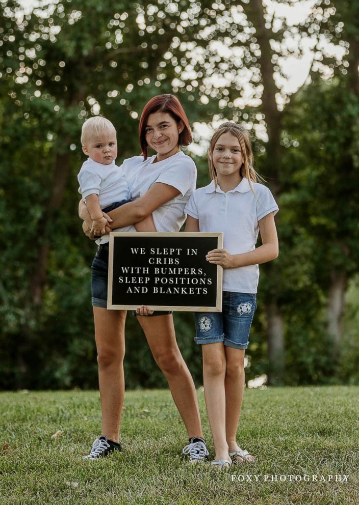 PHOTO: Mom of three Abbie Fox of Las Vegas, photographed kids who held signs explaining the choice their parents made that were judged by others.