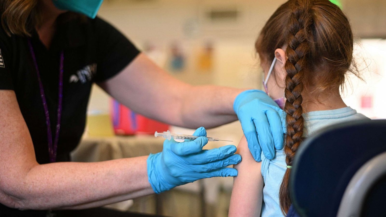 PHOTO: A nurse administers a pediatric dose of the Covid-19 vaccine to a girl at a L.A. Care Health Plan vaccination clinic at Los Angeles Mission College in the Sylmar neighborhood in Los Angeles, Jan. 19, 2022.