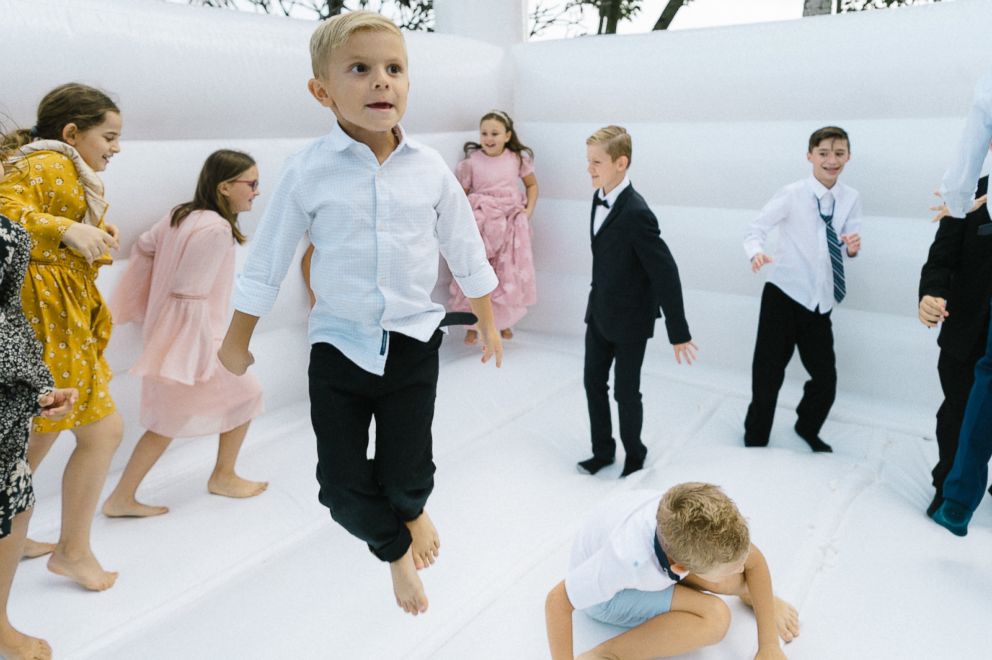 PHOTO: Kids bounce on the castle at Adalynn and Flo Toma's wedding. 