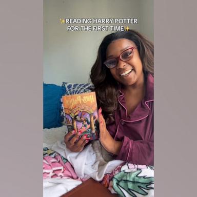 [PHOTO: TikTok creator Kierra Lewis is sharing her journey online reading the Harry Potter series for the first time.]