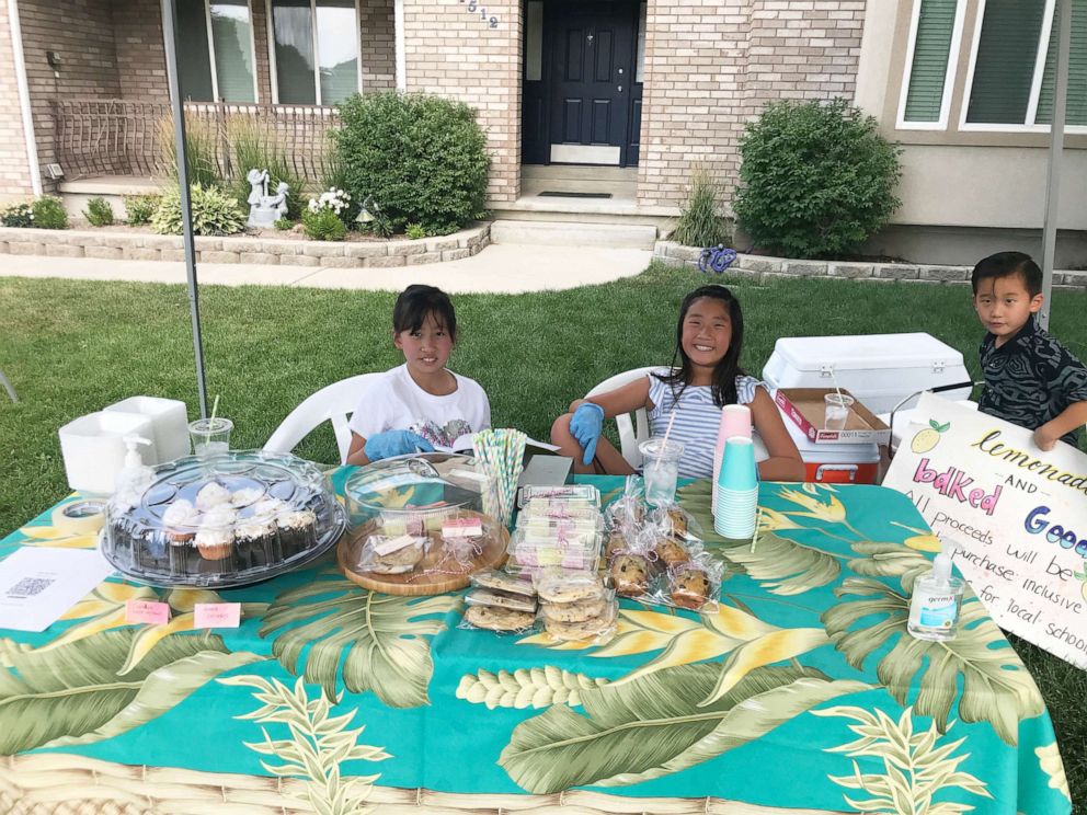 PHOTO: Emi Kim, 9, at her first lemonade and baked goods stand on July 8, 2021, in Provo, Utah.