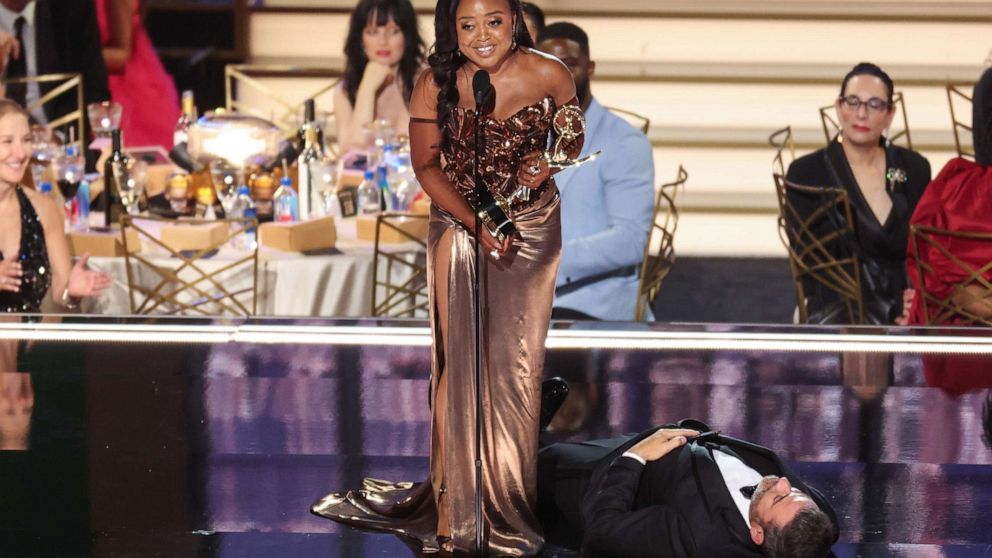 PHOTO: Television host Jimmy Kimmel lies onstage as writer Quinta Brunson accepts the award for outstanding writing for a comedy series for "Abbott Elementary" during the 74th Emmy Awards in Los Angeles, Sept. 12, 2022.