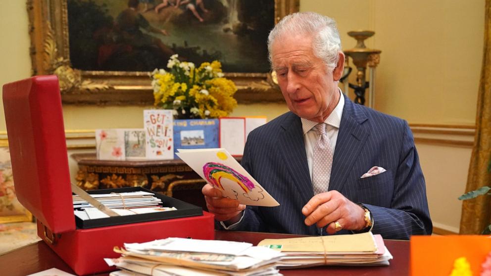 PHOTO: In this photo released on February 23, King Charles III reads cards and messages, sent by well-wishers following his cancer diagnosis, in the 18th Century Room of the Belgian Suite at Buckingham Palace, Feb. 21, 2024, in London, England. 