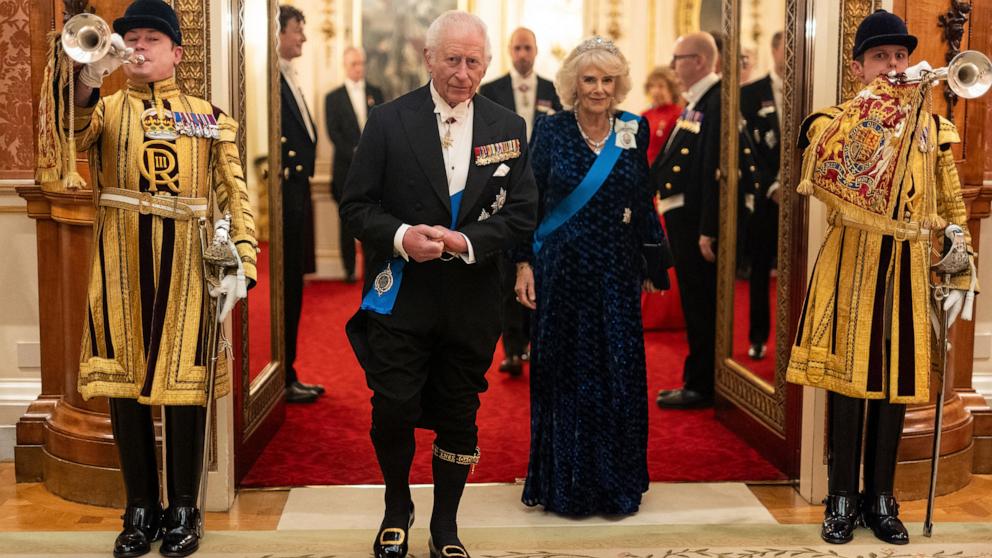 PHOTO: Britain's King Charles III and Britain's Queen Camilla arrive to meet with guests during a reception for members of the Diplomatic Corps at Buckingham Palace in London, Nov. 19, 2024. 