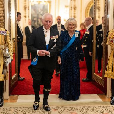 PHOTO: Britain's King Charles III and Britain's Queen Camilla arrive to meet with guests during a reception for members of the Diplomatic Corps at Buckingham Palace in London, Nov. 19, 2024. 