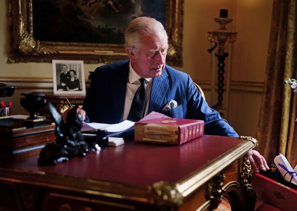 PHOTO: In this photo taken Sept. 11, 2022, Britain's King Charles III carries out official government duties from his red box in the Eighteenth Century Room at Buckingham Palace, London.