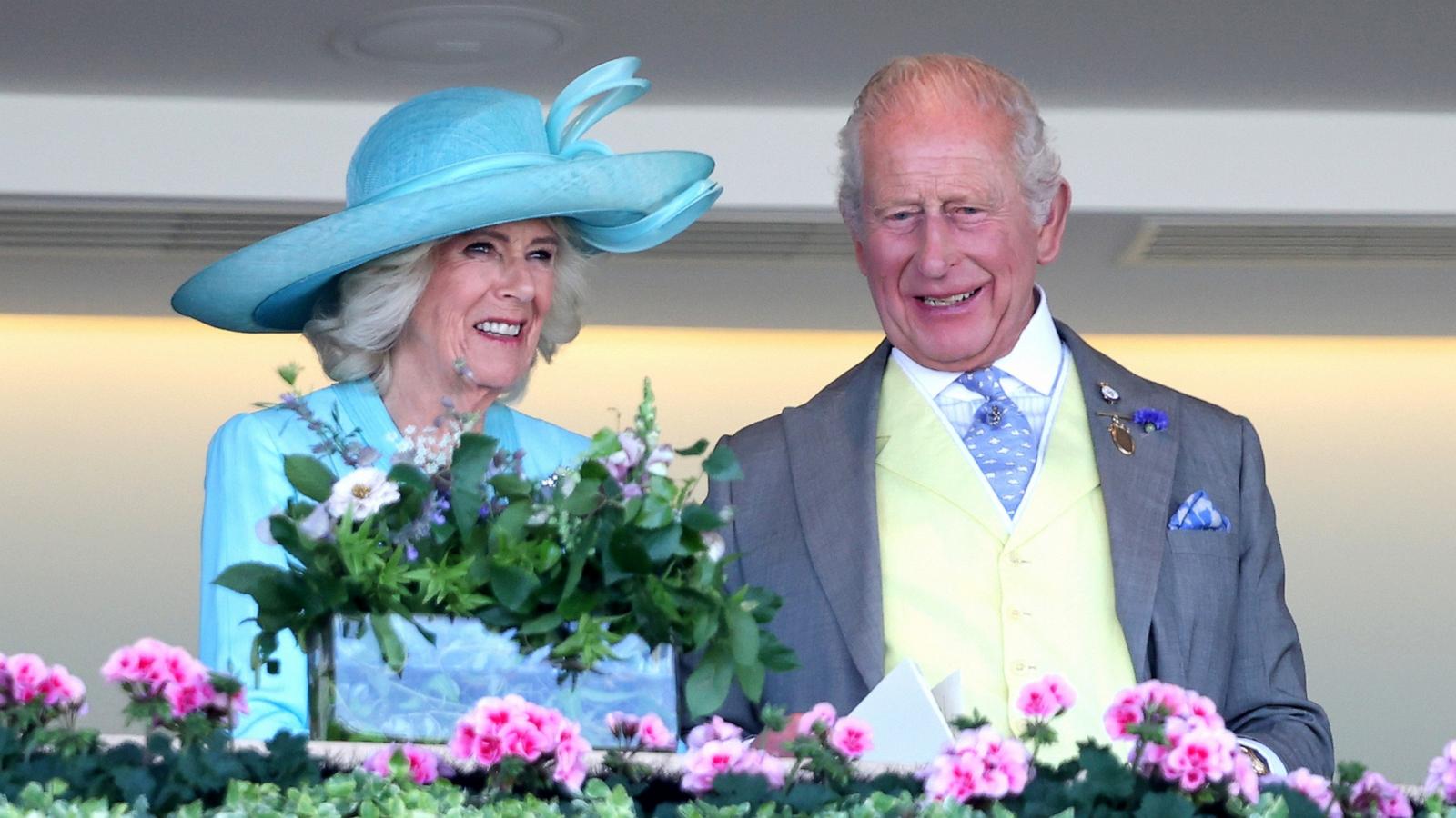 PHOTO: Queen Camilla and King Charles III smile as they attend day four of Royal Ascot 2026 at Ascot Racecourse, June 19, 2026 in Ascot, England.