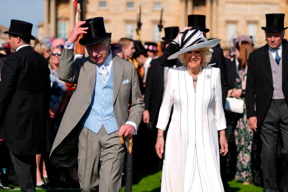 PHOTO: Britain's King Charles III, left, and Queen Camilla attend a Royal Garden Party at Buckingham Palace, May 8, 2024, in London. 