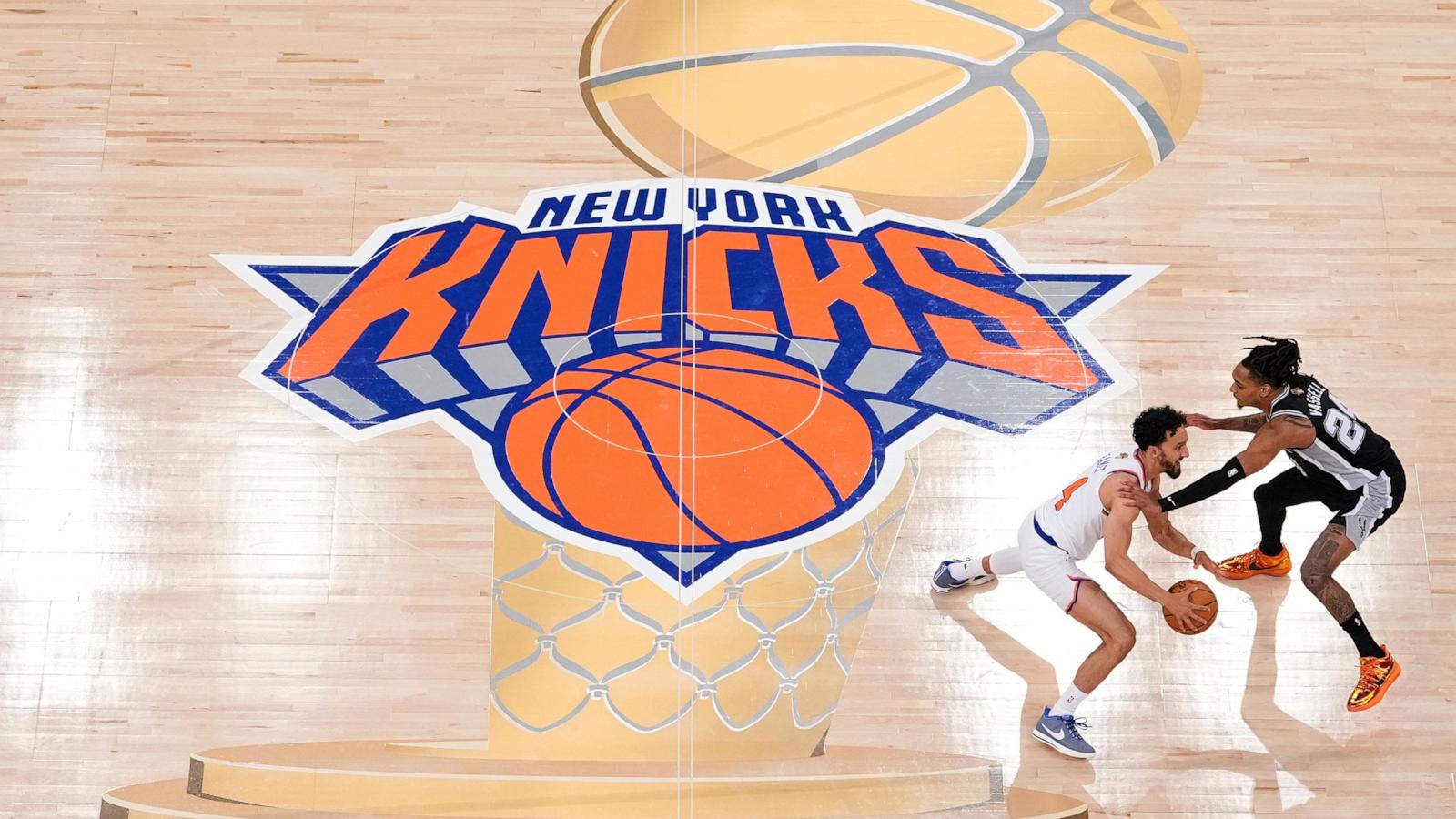 PHOTO: New York Knicks guard Landry Shamet brings the ball up the court against San Antonio Spurs guard Devin Vassell during the second half of Game 3 of the NBA Finals basketball series, June 8, 2026, in New York City.
