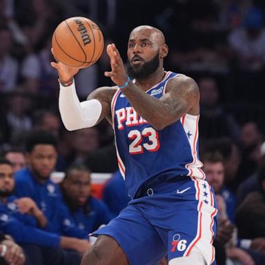 PHOTO: Philadelphia 76ers forward LeBron James grabs a pass during the first half of an NBA basketball game against the New York Knicks, Oct. 20, 2026, in New York City. 