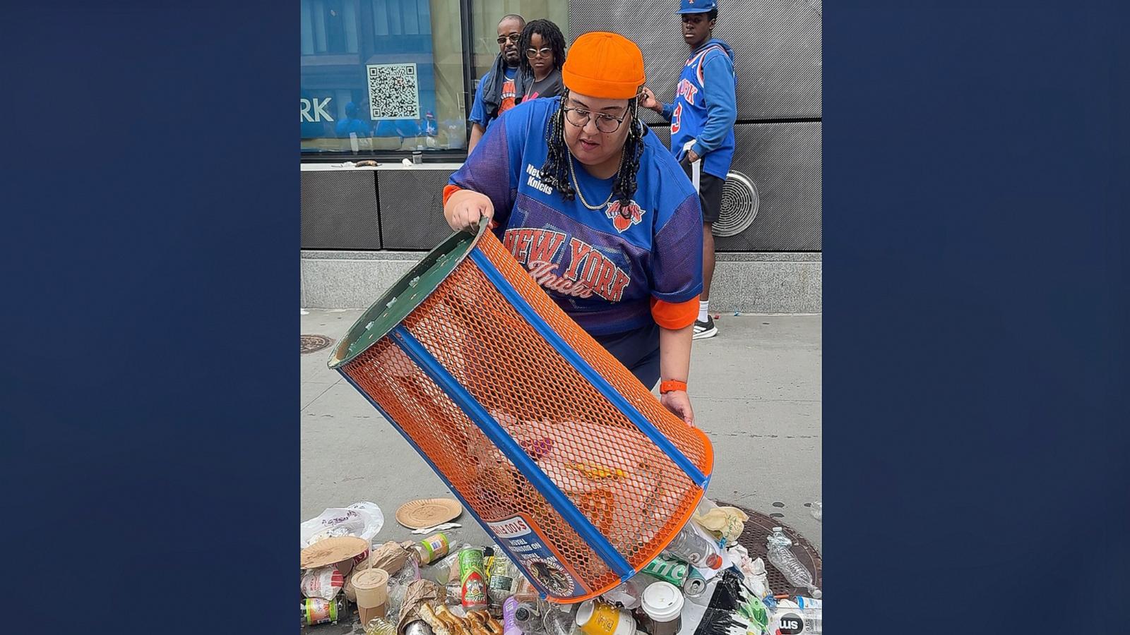 PHOTO: A woman at the New York Knicks victory celebrations emptied and took a Knicks-themed trash can.
