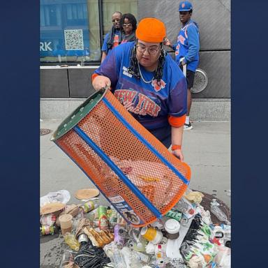 PHOTO: A woman at the New York Knicks victory celebrations emptied and took a Knicks-themed trash can.