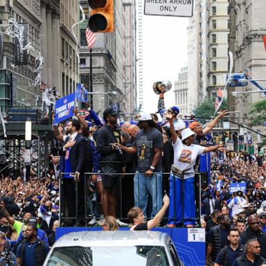 PHOTO: Members of the New York Knicks joined by New York City Mayor Zohran Mamdani ride atop an open-top bus during a championship ticker-tape parade celebrating the team's NBA Finals victory in New York, on June 18, 2026. 