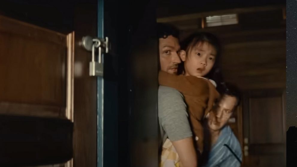 PHOTO: Ben Aldridge, Jonathan Groff, and Kristen Cui are shown in a scene from the movie, "Knock At The Cabin."
