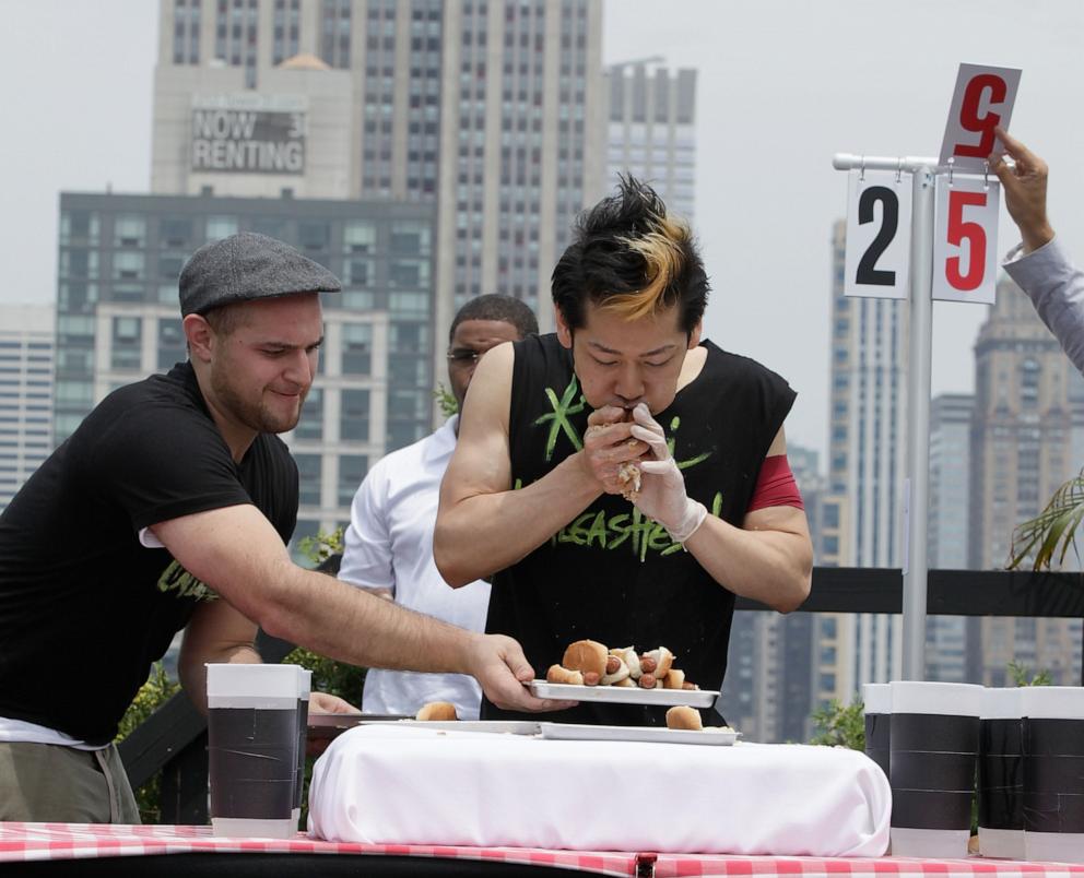 PHOTO: In this July 4, 2011, file photo, Takeru Kobayashi challeges contestants via satellite at 230 Fifth Avenue, in New York.