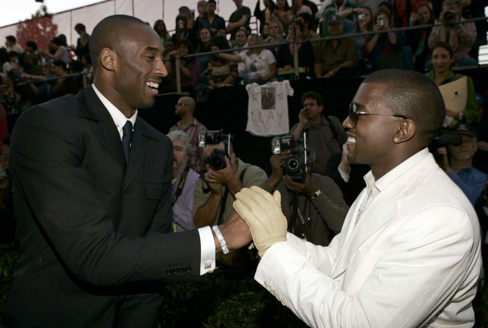 PHOTO: In this Nov. 14, 2004, file photo, Kobe Bryant and Kanye West greet each other on the red carpet before the 32nd Annual American Music Awards in Los Angeles.