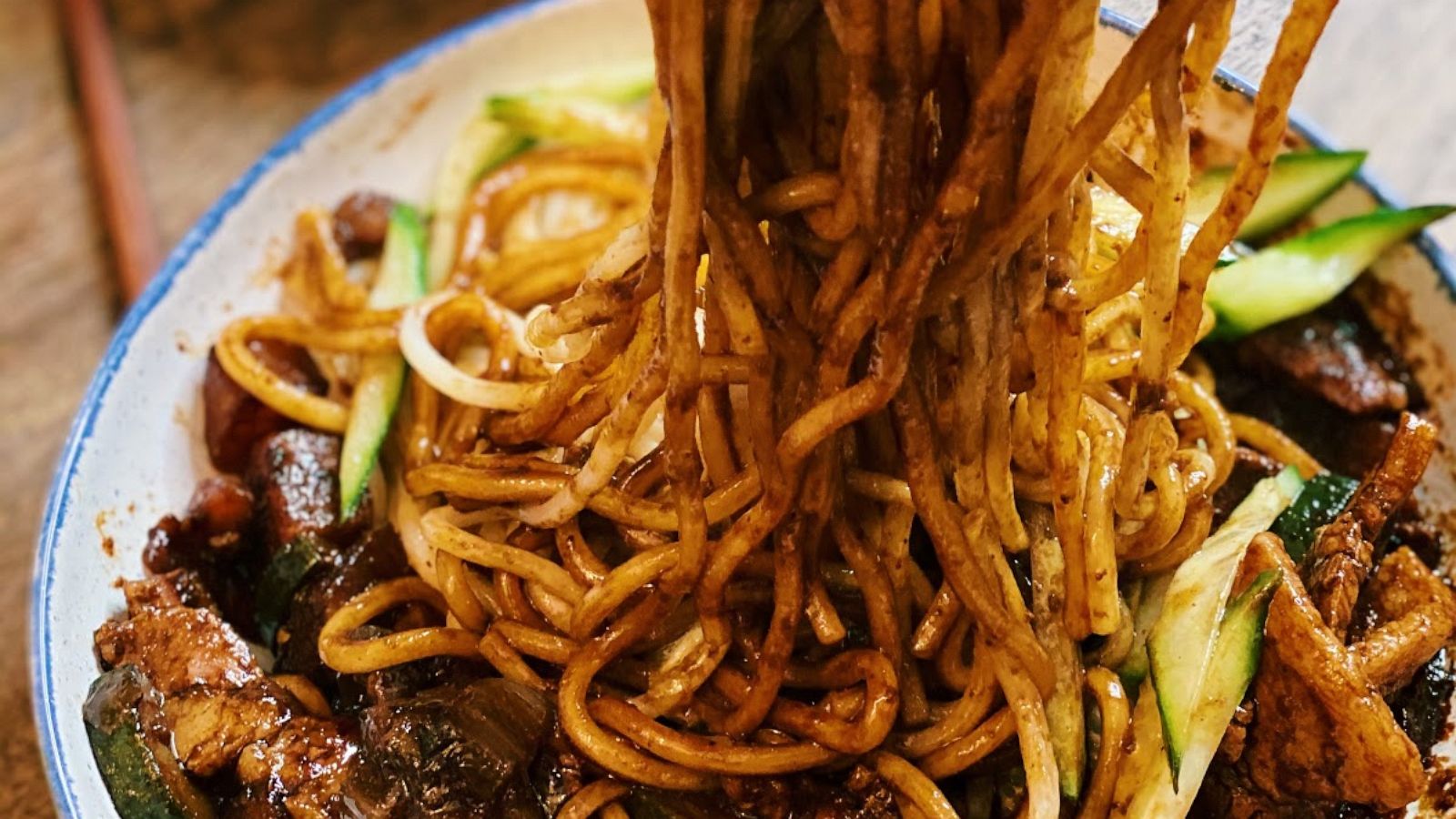 PHOTO: Korean black bean noodles with pork belly and veggies.