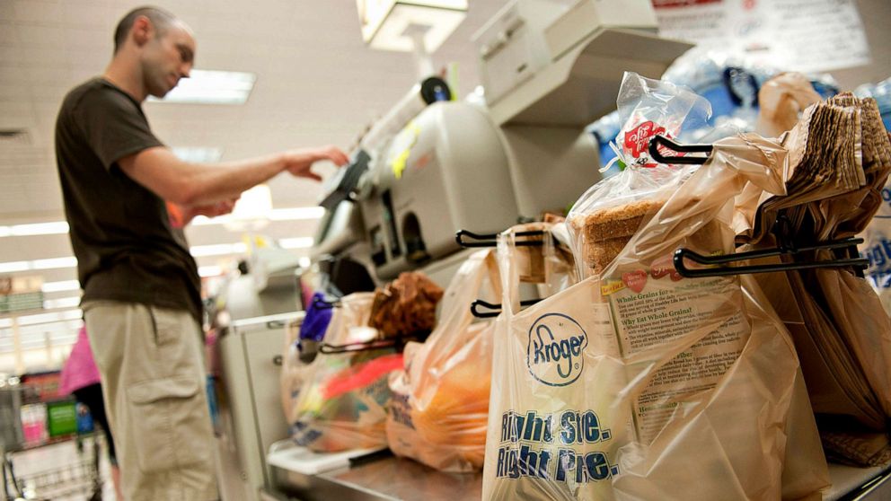 PHOTO: Customer Eric Harms uses a self-checkout machine at a Kroger Co. supermarket in Peoria, Illinois, June 12, 2012.