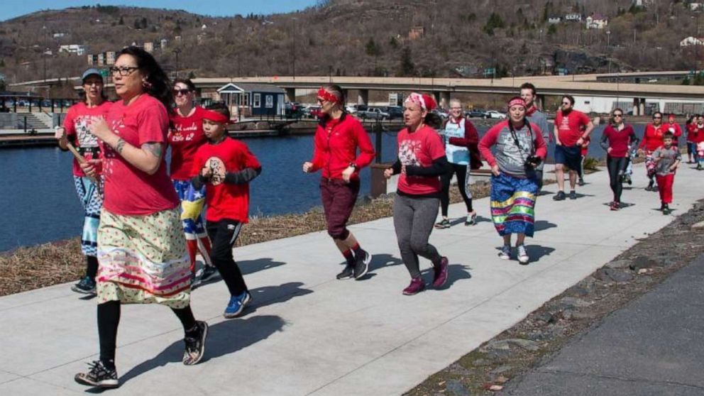 PHOTO: Female runners in KwePack run in Duluth, Minn., on May 5 2019, for the National Day of Awareness for Missing and Murdered Indigenous Women.