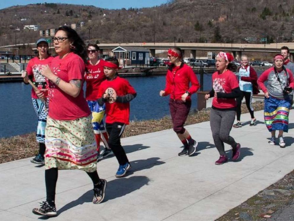 PHOTO: Female runners in KwePack run in Duluth, Minn., on May 5 2019, for the National Day of Awareness for Missing and Murdered Indigenous Women.