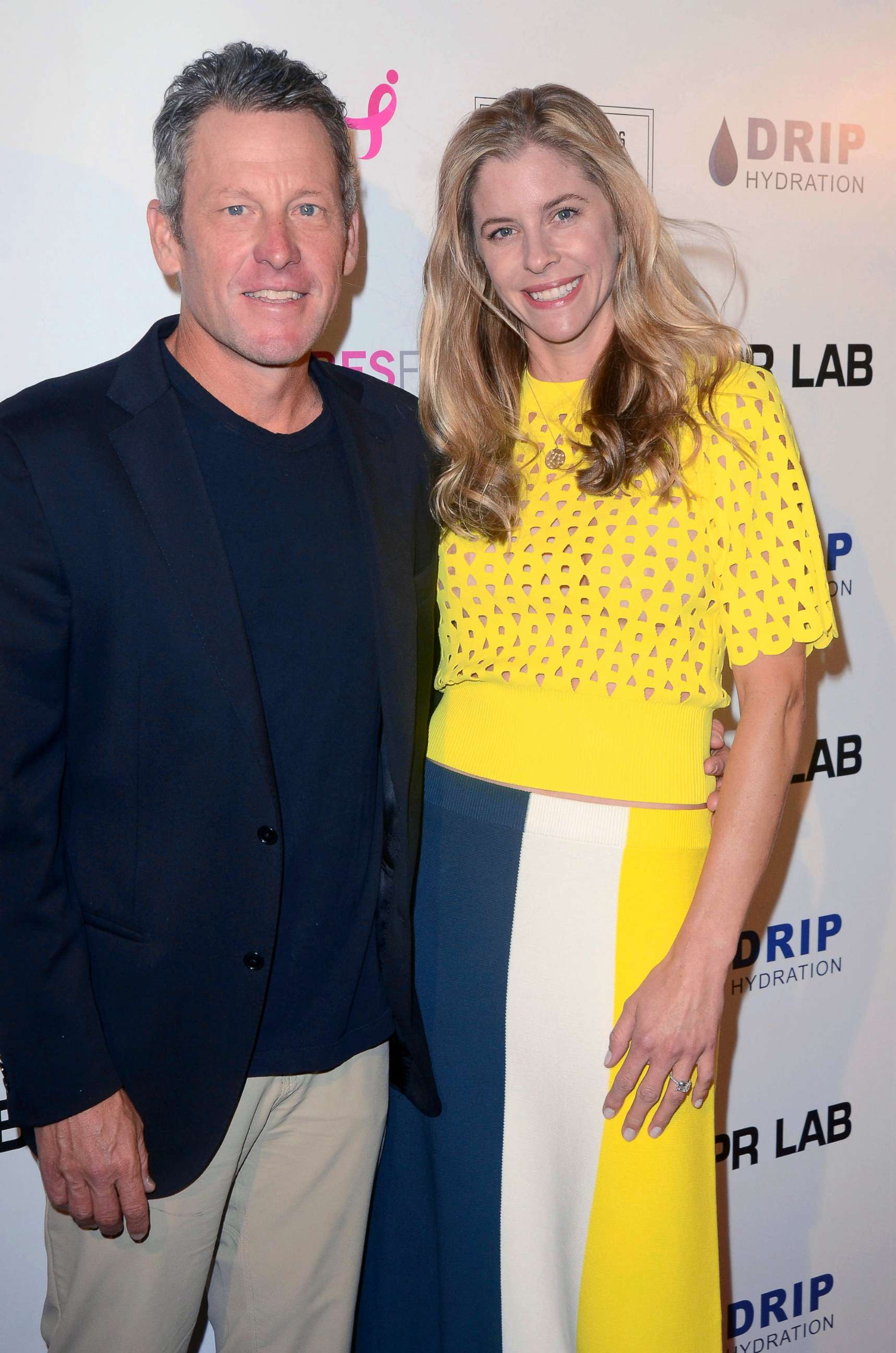 PHOTO: Lance Armstrong and Anna Hansen pose for a portrait while atteding an auction at the El Rey Theater in Los Angeles, on June 7, 2018.