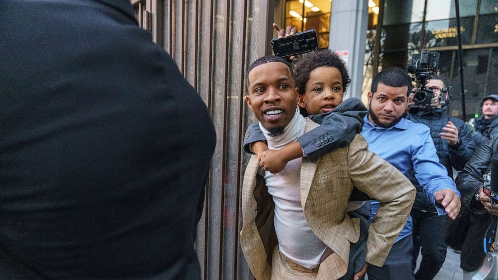 PHOTO: In this Dec. 13, 2022 file photo Rapper Tory Lanez walks out of the courthouse while holding his 5-year-old son Kai'Lon in Los Angeles.