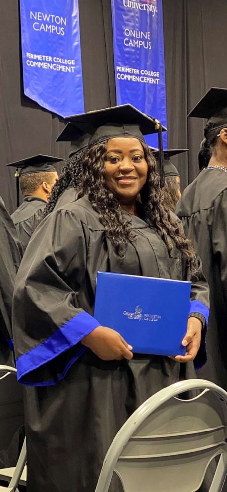 PHOTO: Latonya Young poses at her December 2019 graduation ceremony at Georgia State University.