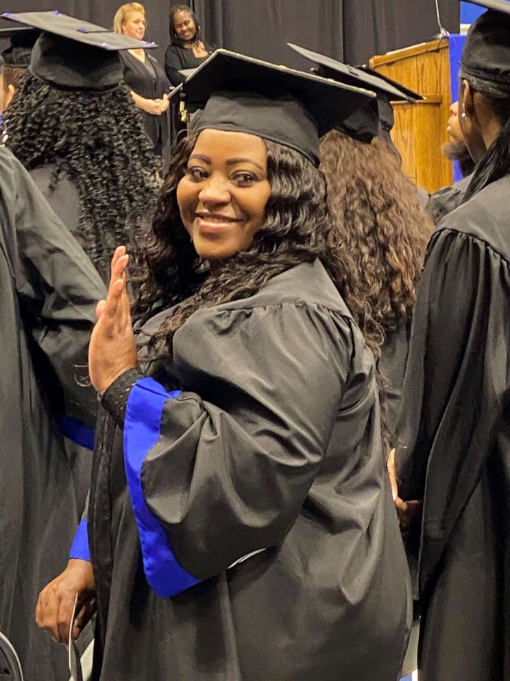 PHOTO: Latonya Young poses at her December 2019 graduation ceremony at Georgia State University.