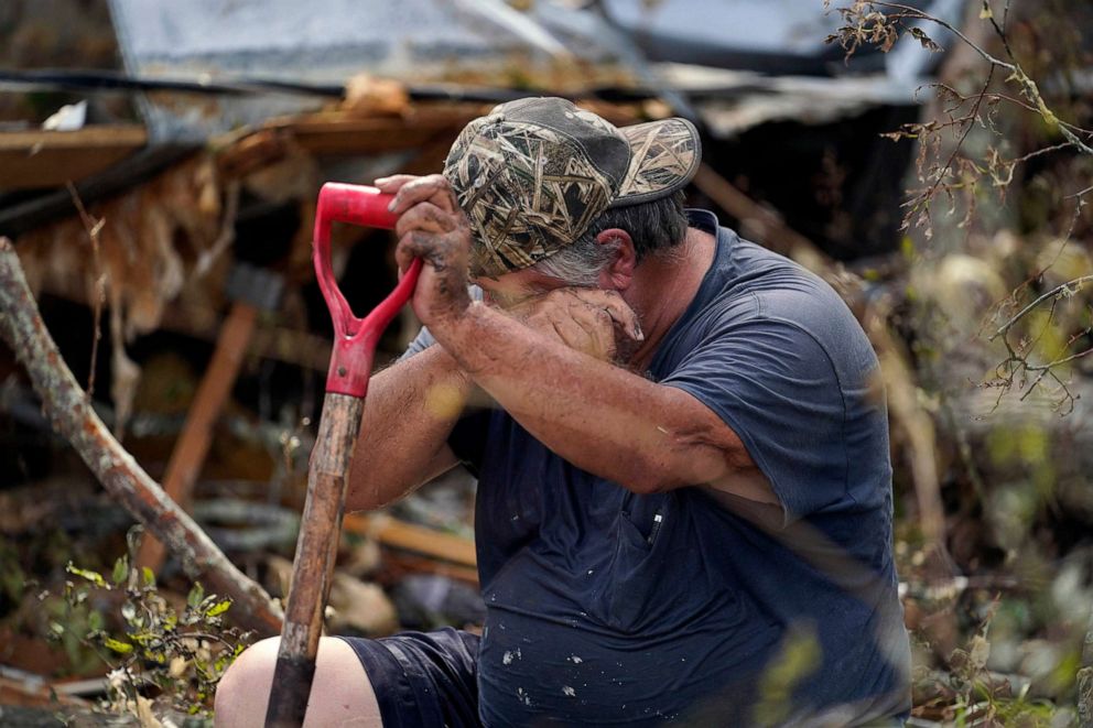 PHOTO: Bradley Beard rests next to his heavily damaged home in the aftermath of Hurricane Laura in Hackberry, La., Aug. 29, 2020.