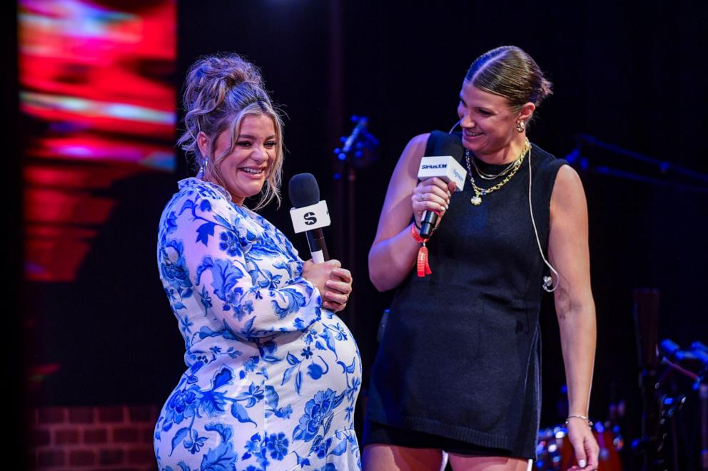 PHOTO: Lauren Alaina speaks onstage during SiriusXM The Highway's Music Row Happy Hour: CMA Fest Edition at Chief's In Nashville at Chief's on June 7, 2025, in Nashville, Tenn.