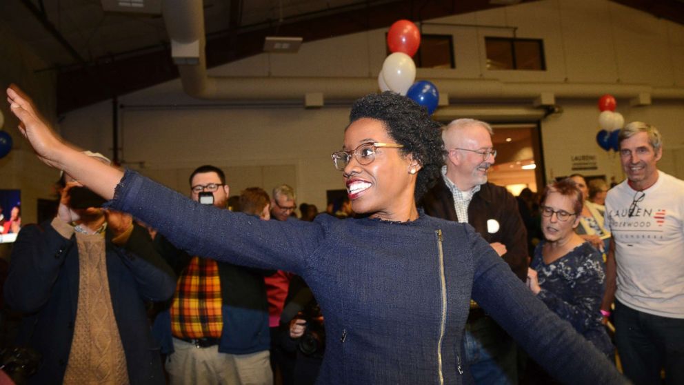 PHOTO: Lauren Underwood, the Democratic candidate in Illinois' 14th District, visits with others at her election night party in St. Charles, Illinois, Nov. 6, 2018.