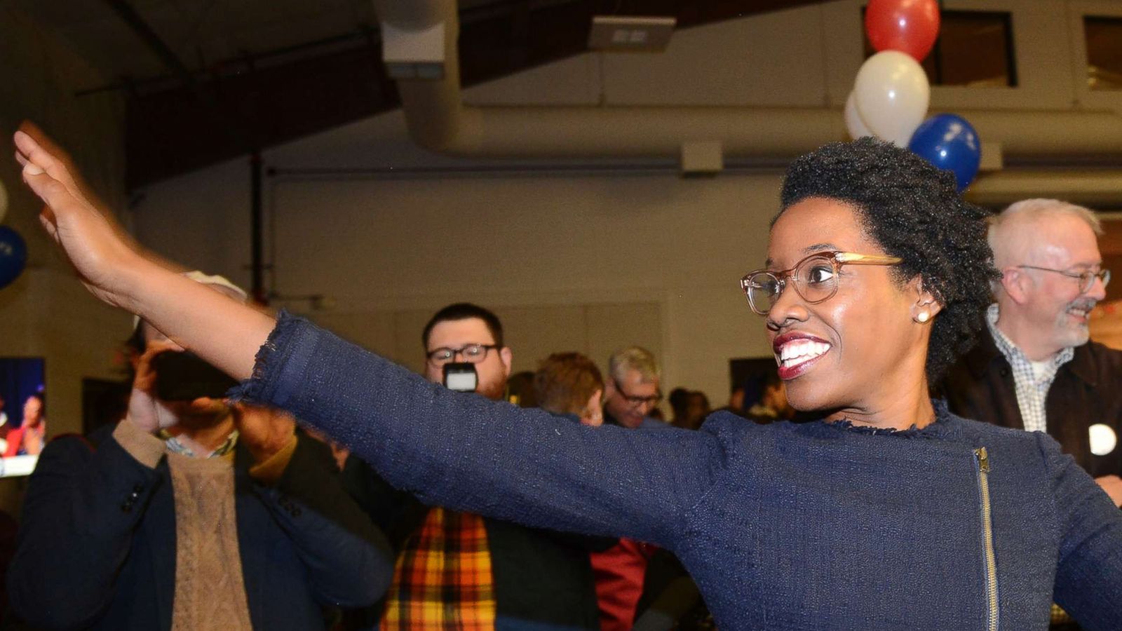 PHOTO: Lauren Underwood, the Democratic candidate in Illinois' 14th District, visits with others at her election night party in St. Charles, Illinois, Nov. 6, 2018.