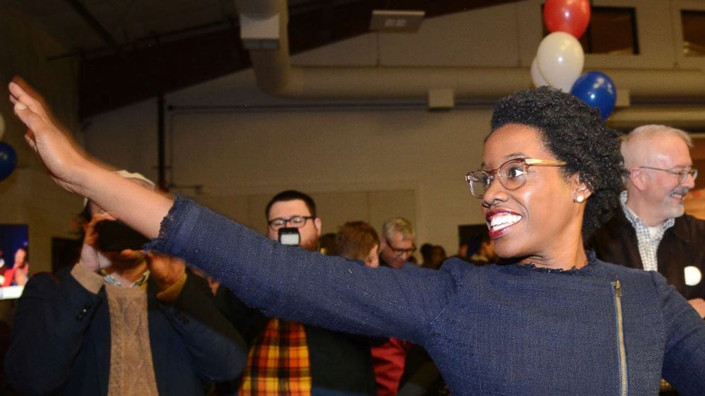 Lauren Underwood, the Democratic candidate in Illinois' 14th District, visits with others at her election night party in St. Charles, Illinois, Nov. 6, 2018.