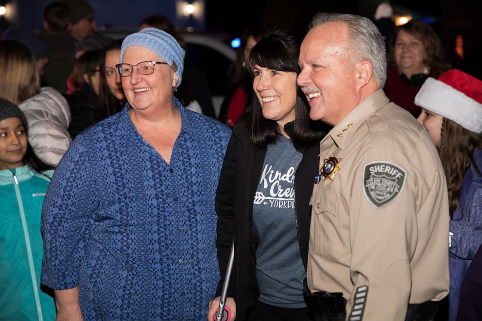 PHOTO: Laurie Burpee, far left, poses with York Elementary School principal Dawn Harris, center, and Clark County Sheriff Chuck Atkins.
