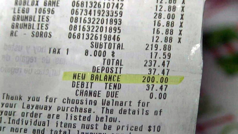 PHOTO: Tania McCarthy shows a receipt for Christmas presents for her two sons at Walmart that was paid off by a so-called "layaway angel."