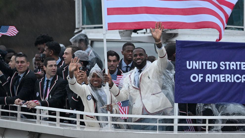 PHOTO: U.S.A. flag bearers Coco Gauff and Lebron James are seen at the opening ceremony of the Summer Olympics, July 26, 2024, in Paris. 