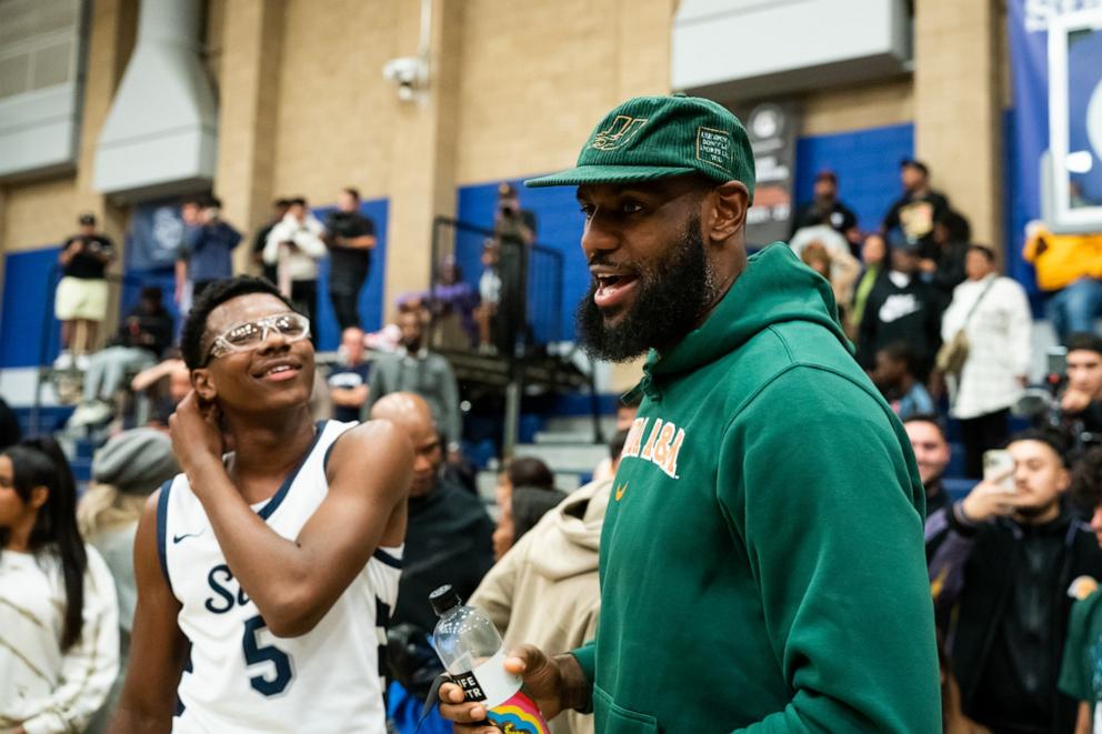 PHOTO: Bryce James talks to his dad, LeBron James, after the Sierra Canyon vs King Drew boys' basketball game at Sierra Canyon High School, November 16, 2022, in Chatsworth, Calif.