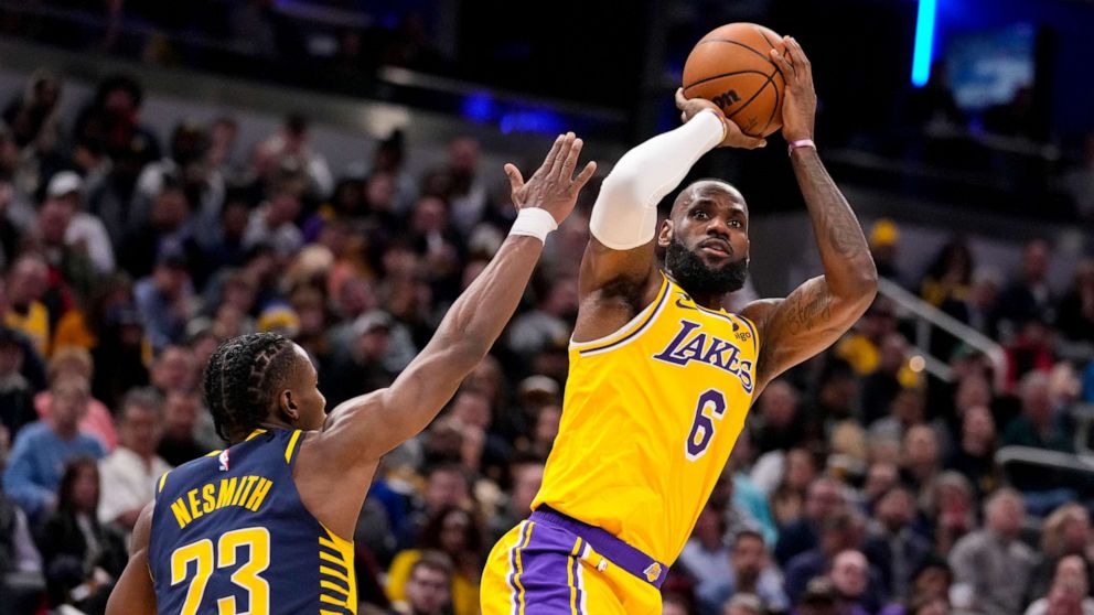 PHOTO: Los Angeles Lakers forward LeBron James (6) shoots over Indiana Pacers forward Aaron Nesmith (23) during the first half of an NBA basketball game in Indianapolis, Feb. 2, 2023.