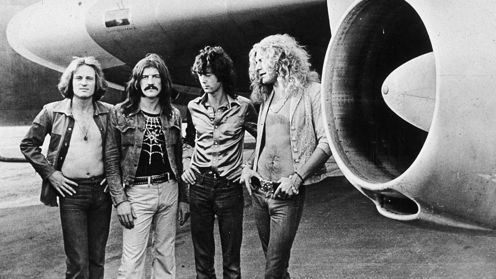 PHOTO: Led Zeppelin pose in front of an their private airliner "The Starship," in 1973.