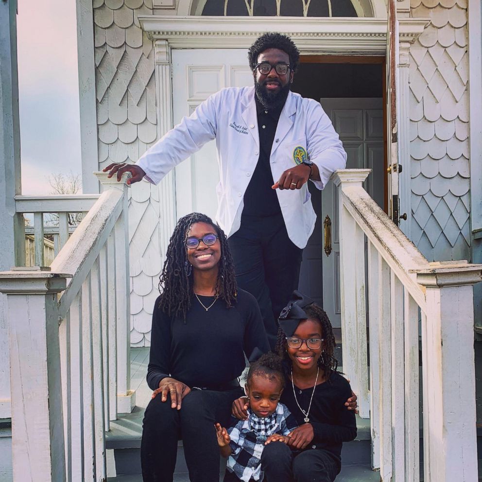 PHOTO: Dr. Russell Ledet, a medical student at Baton Rouge General Medical Center in Louisiana, smiles alongside his wife and two daughters on Dec. 14, 2019.
