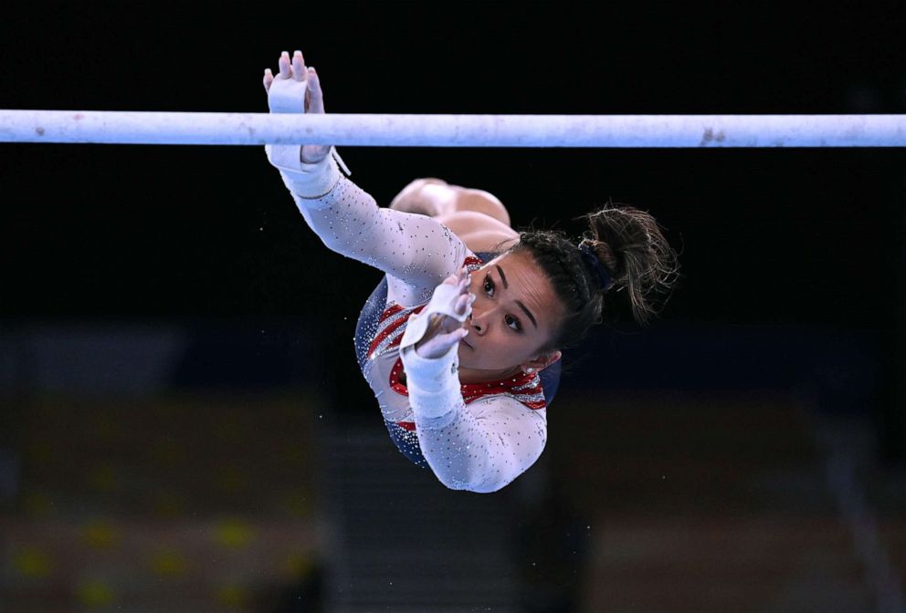 PHOTO: Sunisa Lee of the United States performs on the uneven bars, July 29, 2021, during the Women's Individual All-Around, at the Tokyo Olympics.