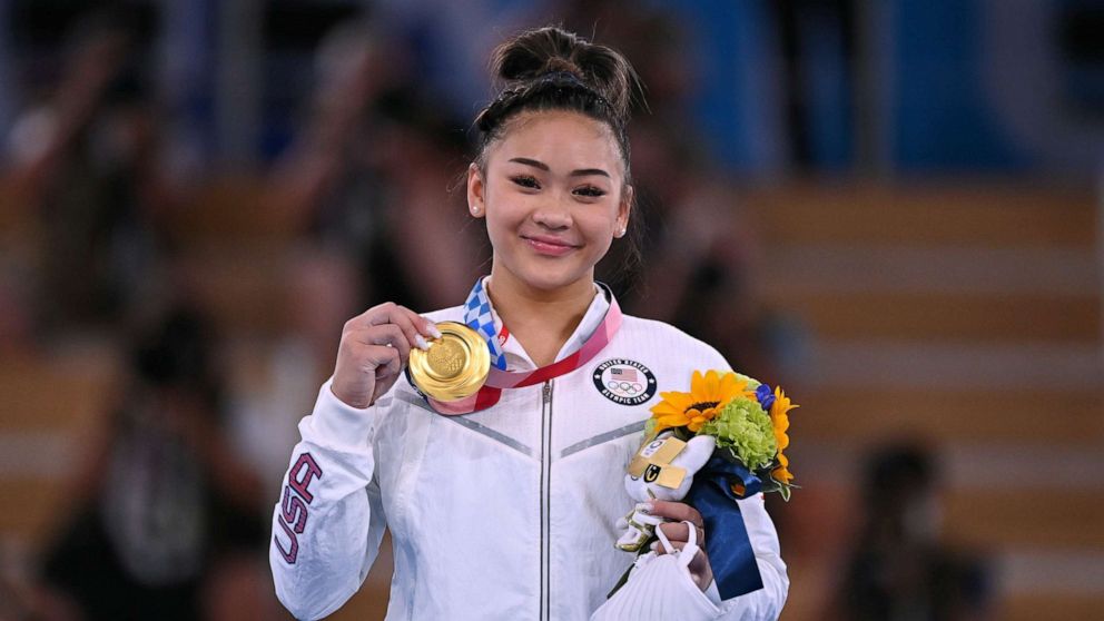 PHOTO: Gold medallist Sunisa Lee of the United States poses on the podium after winning the Women's Individual All-Around, July 29, 2021, in Tokyo.