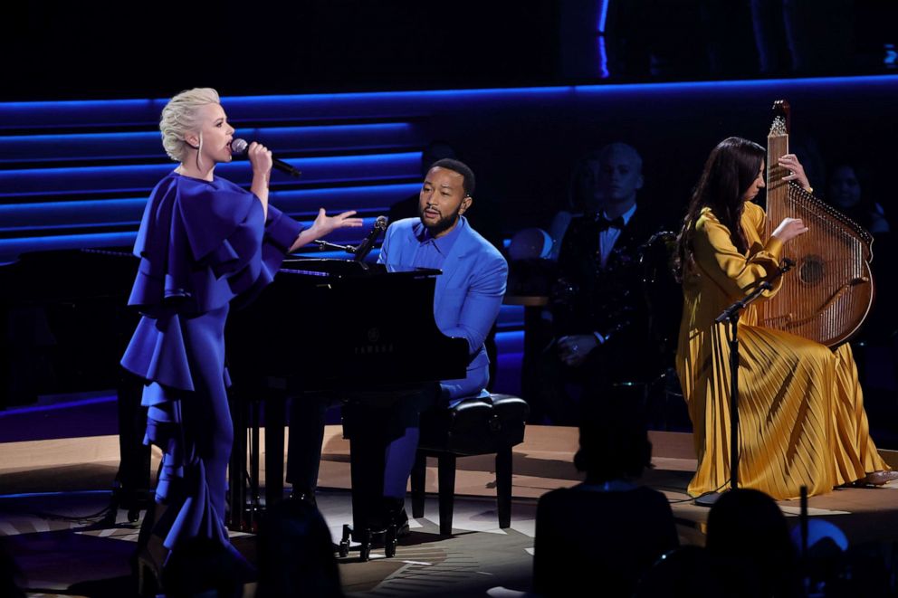 PHOTO: Mika Newton, John Legend, and Siuzanna Iglidan perform onstage during the 64th GRAMMY Awards at MGM Grand Garden Arena, April 3, 2022, in Las Vegas.