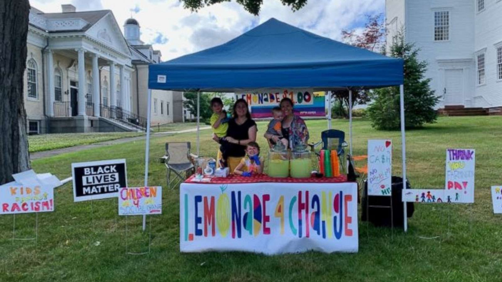 PHOTO: Amanda Gorman and her kids pose with their neighbor, Chelsea O'Donnell and her son at their Lemonade 4 Change stand in Farmington, CT.