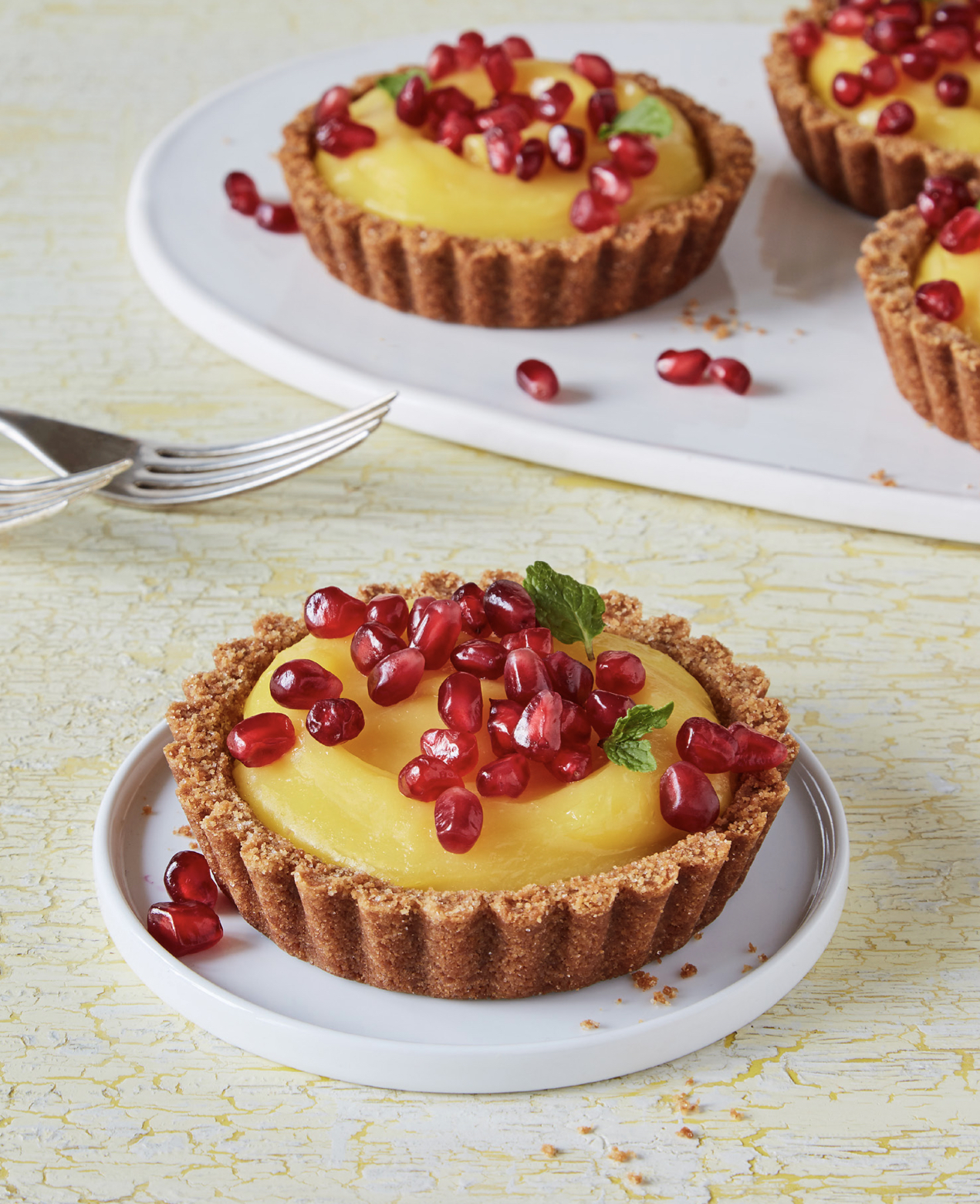 PHOTO: Homemade lemon tarts with fresh pomegranate arils.