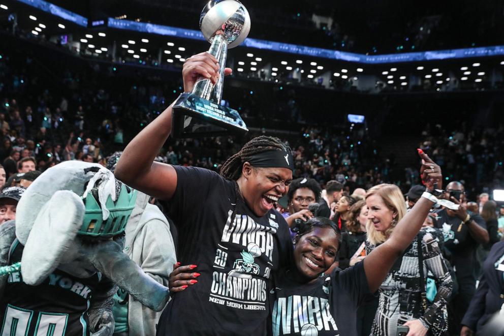 PHOTO: New York Liberty forward Jonquel Jones (35) holds up the MVP trophy after defeating the Minnesota Lynx in overtime to win the 2024 WNBA Finals at Barclays Center, Oct. 20, 20024 in Brooklyn.