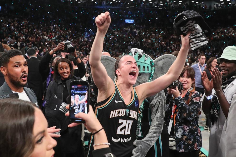 PHOTO: WNBA: New York Liberty guard Sabrina Ionescu (20) celebrates after defeating the Minnesota Lynx in overtime to win the 2024 WNBA Finals at Barclays Center in Brooklyn, Oct. 20, 2024.